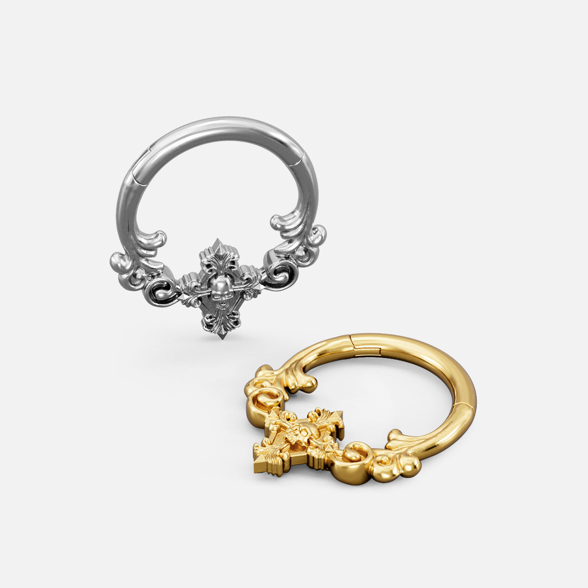Silver and gold Classical Phantasm clickers shown open and lying flat