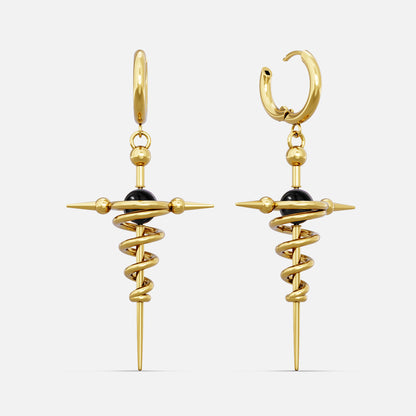 Gold-tone cosmic flow earrings with a spiral spike form and a black bead center, shown as a pair