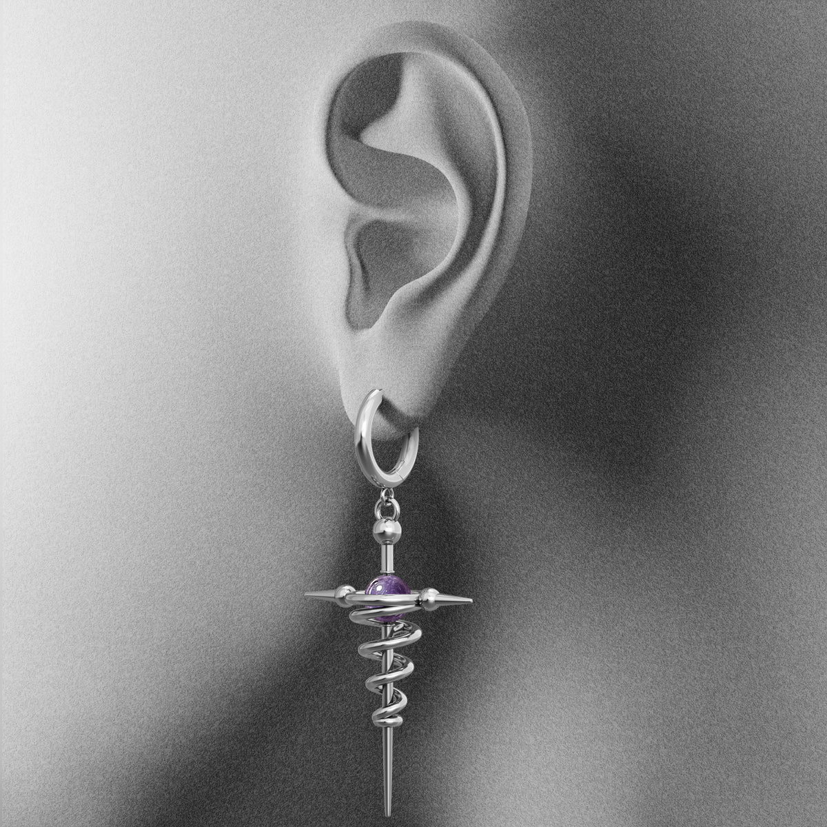 Silver Cosmic Flow drop earring with purple accent shown on an ear illustration