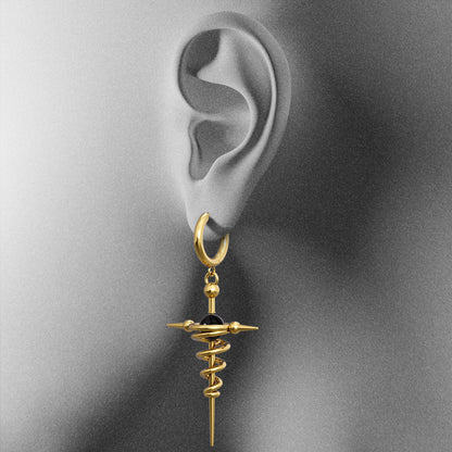 Gold Cosmic Flow drop earring with spiral and pointed pendant shown on an ear illustration
