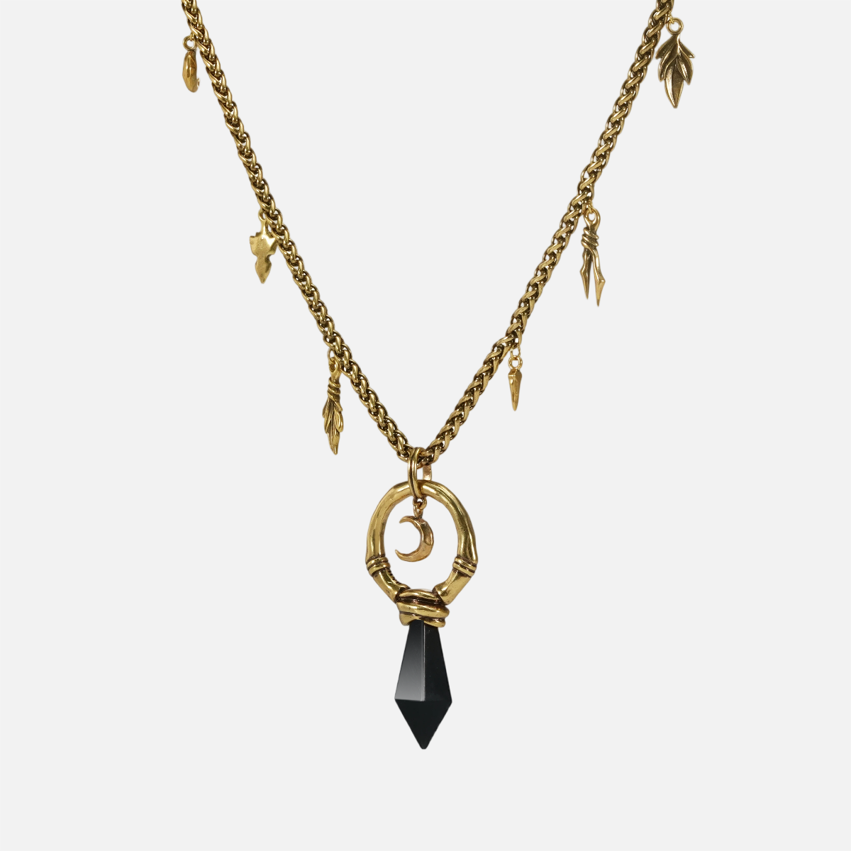 Gold Crescent Ward Necklace with crescent moon ring, black obsidian spike, and leaf charm chain