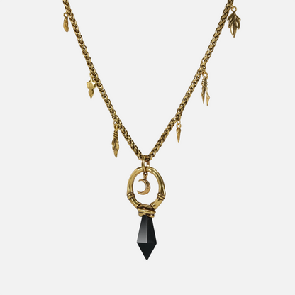 Gold Crescent Ward Necklace with crescent moon ring, black obsidian spike, and leaf charm chain
