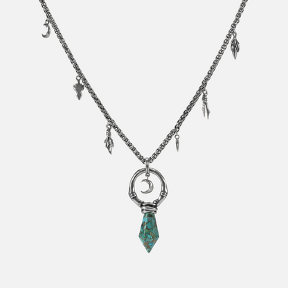 Crescent Ward Necklace in silver plating with crescent moon ring, turquoise spike pendant, and antiqued finish