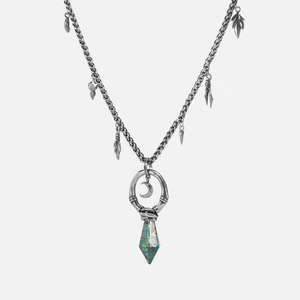 Silver Crescent Ward Necklace with turquoise spike pendant, crescent moon detail, and antiqued finish