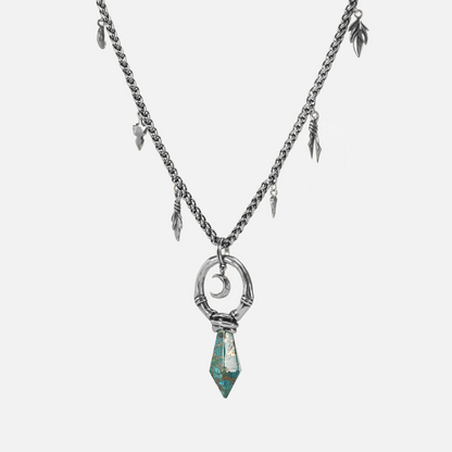 Silver Crescent Ward Necklace with turquoise spike pendant, crescent moon detail, and antiqued finish