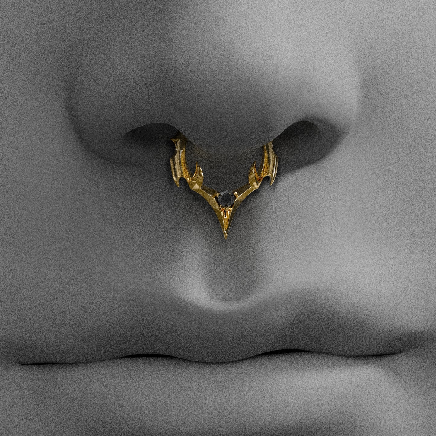 Gold Crest Point clicker worn as a septum ring on a face illustration