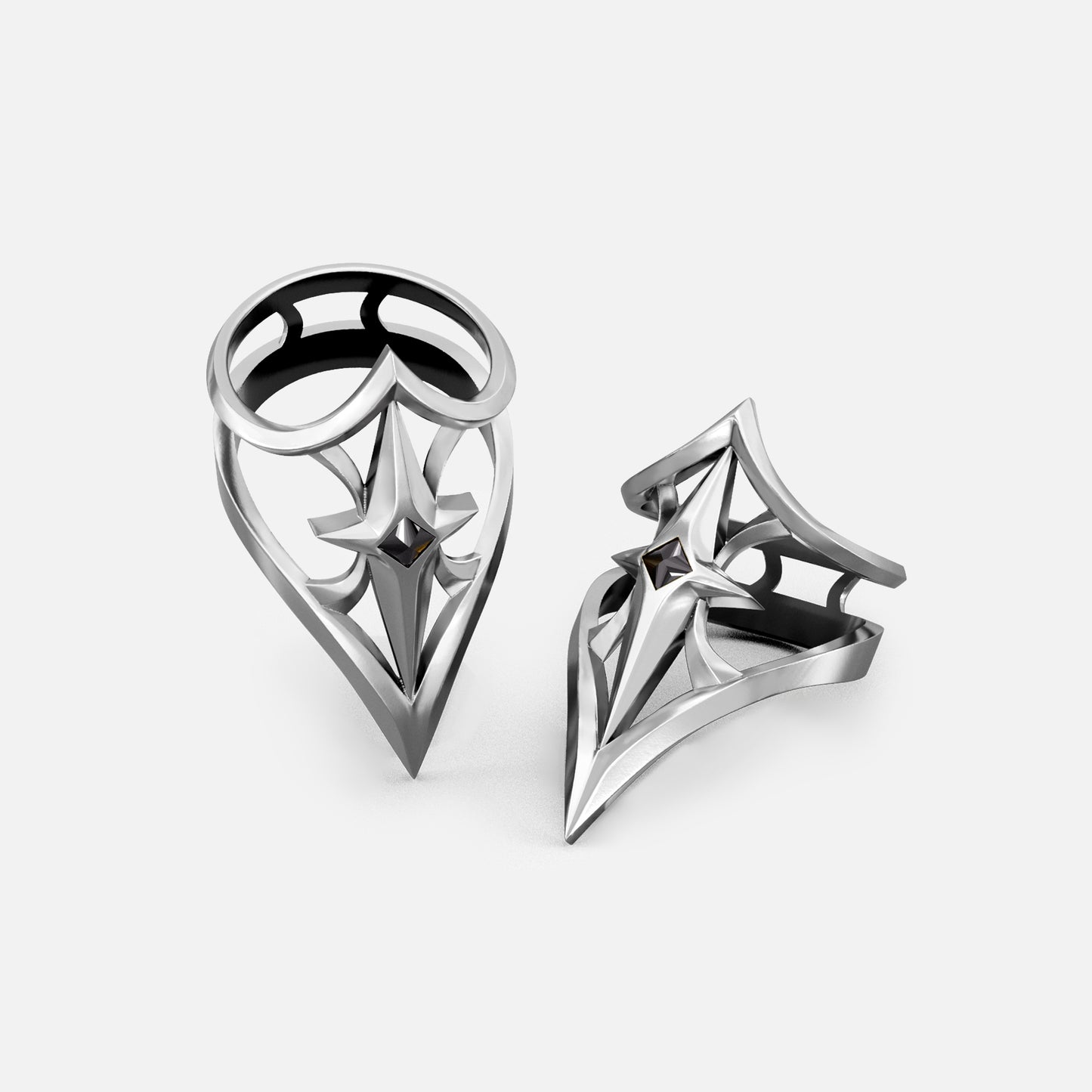 Two silver-tone Crest Shield rings shown upright and angled with open geometric shield faces
