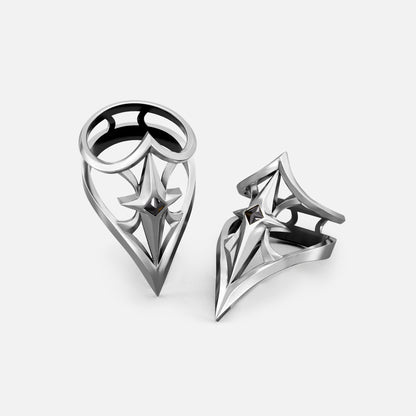 Two silver-tone Crest Shield rings shown upright and angled with open geometric shield faces