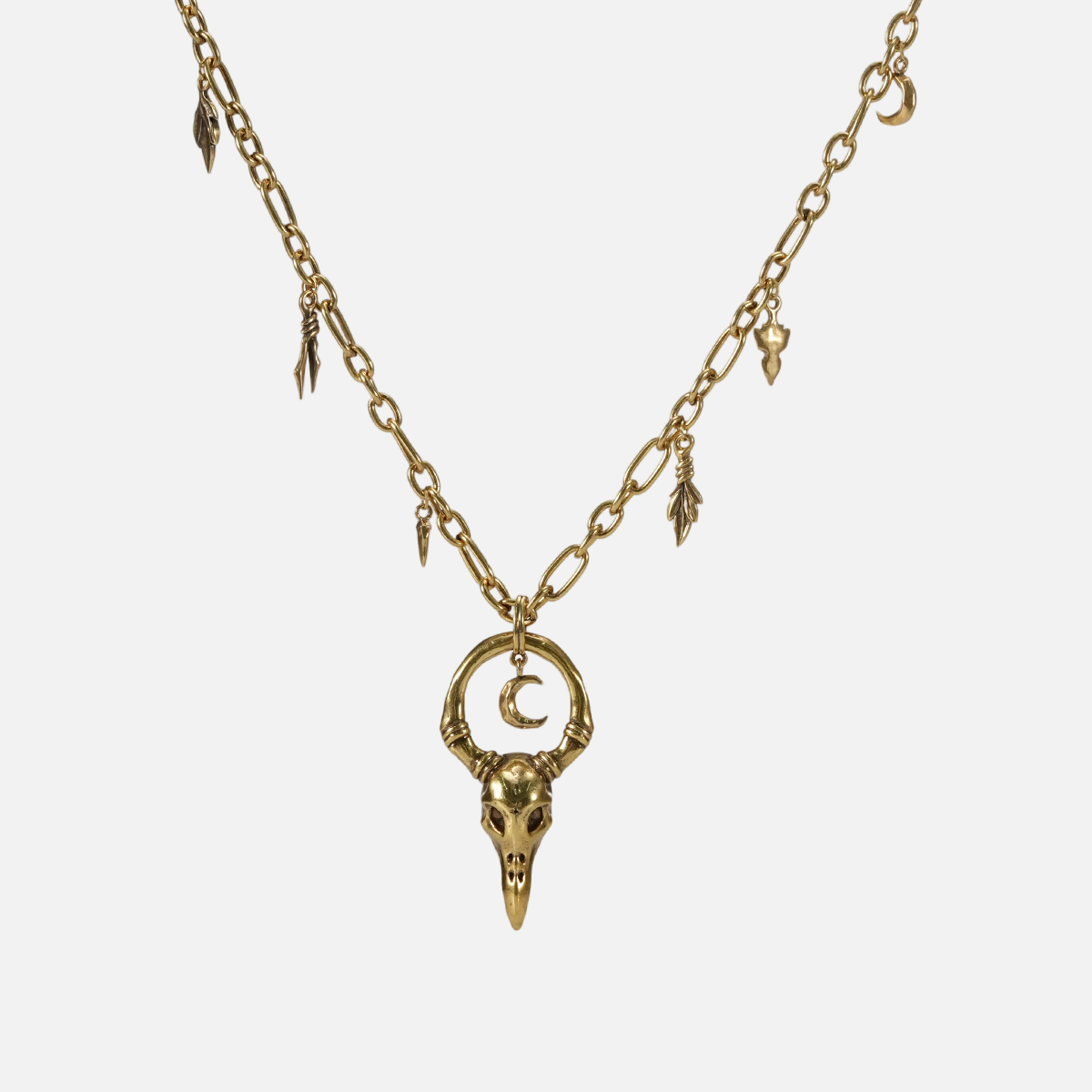 Crow Ward Necklace in 18K gold plating with bird skull pendant and crescent moon detail