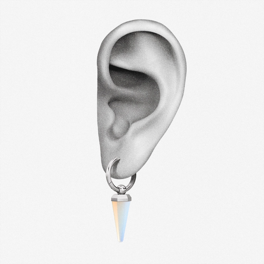 Silver-tone Crystal Prismatic hoop earring with an iridescent point positioned on an illustrated earlobe