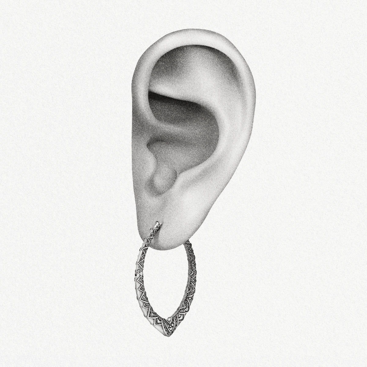 Silver Cultural Essence hoop earring shown on an ear illustration