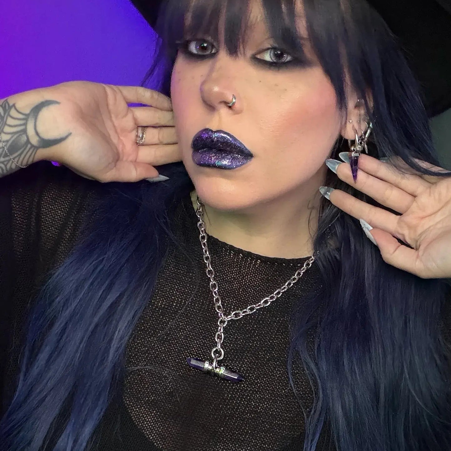 dual prism necklace shown on a model, featuring a silver chain necklace with a horizontally set purple double-terminated crystal pendant