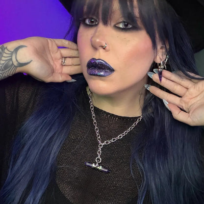 dual prism necklace shown on a model, featuring a silver chain necklace with a horizontally set purple double-terminated crystal pendant