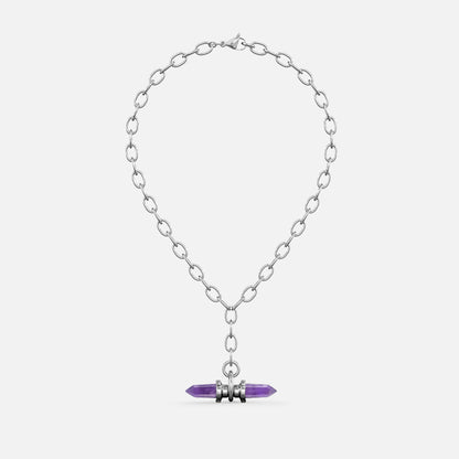 Silver-tone chain necklace with a purple crystal prism pendant wrapped in metal rings, shown flat against a plain background