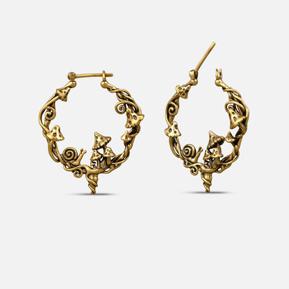 Pair of gold-tone hoop earrings featuring mushroom, snail, and swirling vine motifs, front and side view