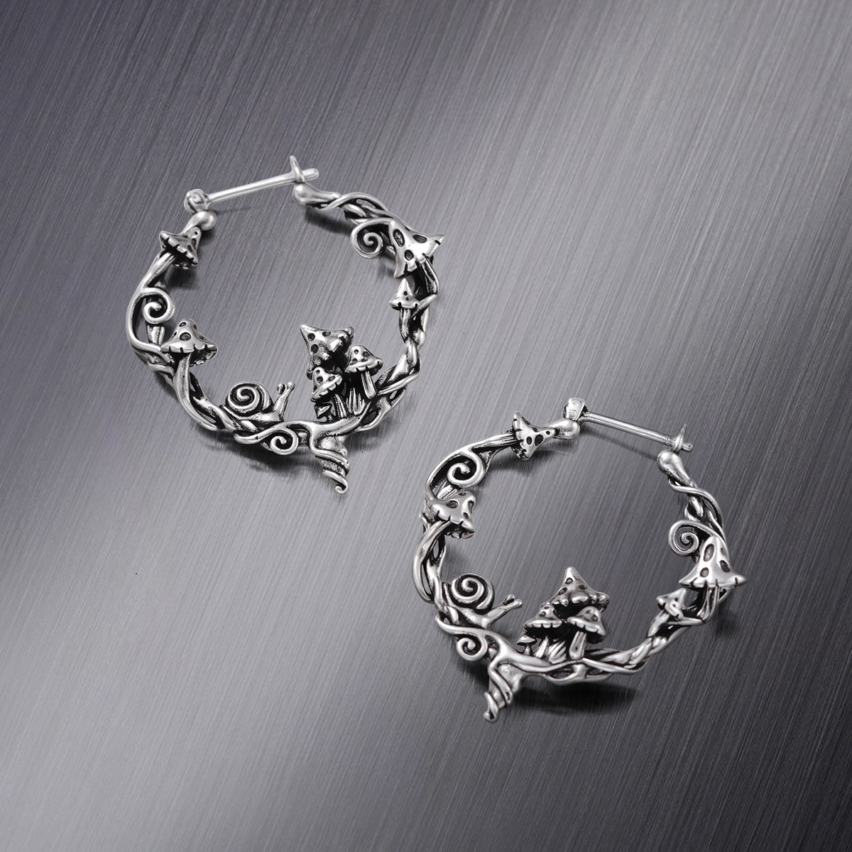 Pair of silver Enchanted Forest Whimsy hoop earrings with woodland fox motifs