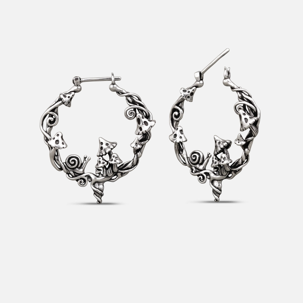 Silver-tone Enchanted Forest Whimsy hoop earrings with mushrooms, leaves, and woodland details