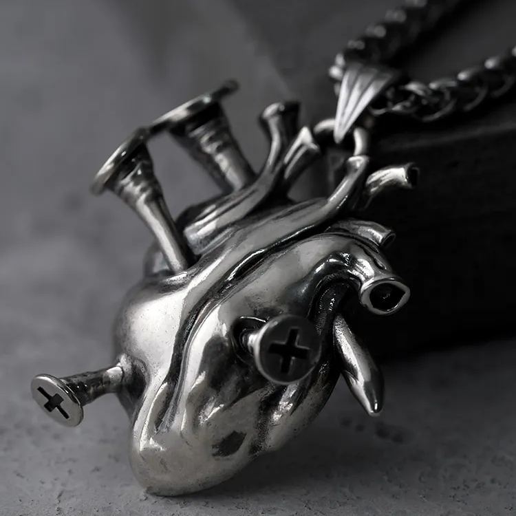 Close-up of silver Enduring Heart anatomical heart pendant