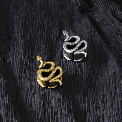 Silver and gold Enigmatic Serpent tunnels displayed on black feathers