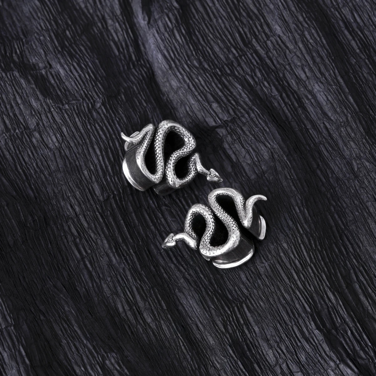 Two silver Enigmatic Serpent tunnels shown from different angles