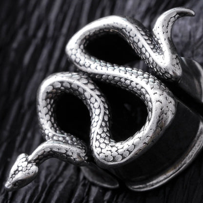 Close-up of silver Enigmatic Serpent tunnel with coiled snake design