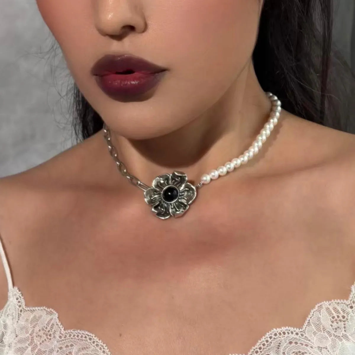 Equinox Bloom Choker styled on model with floral pendant, black bead chain, and gothic romantic jewelry look