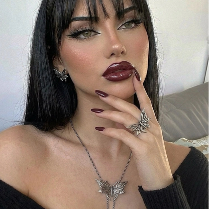 eternal moth rings shown in a model hand view, featuring a silver moth-shaped ring worn on the finger