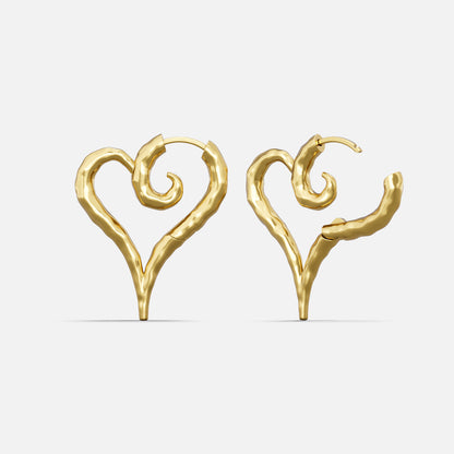 Pair of gold Ethereal Heartflow earrings with open heart silhouettes