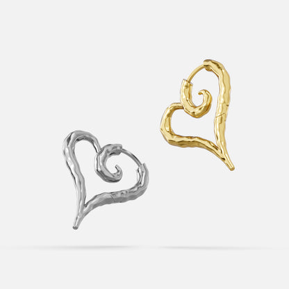 Silver and gold Ethereal Heartflow earrings with open heart silhouettes