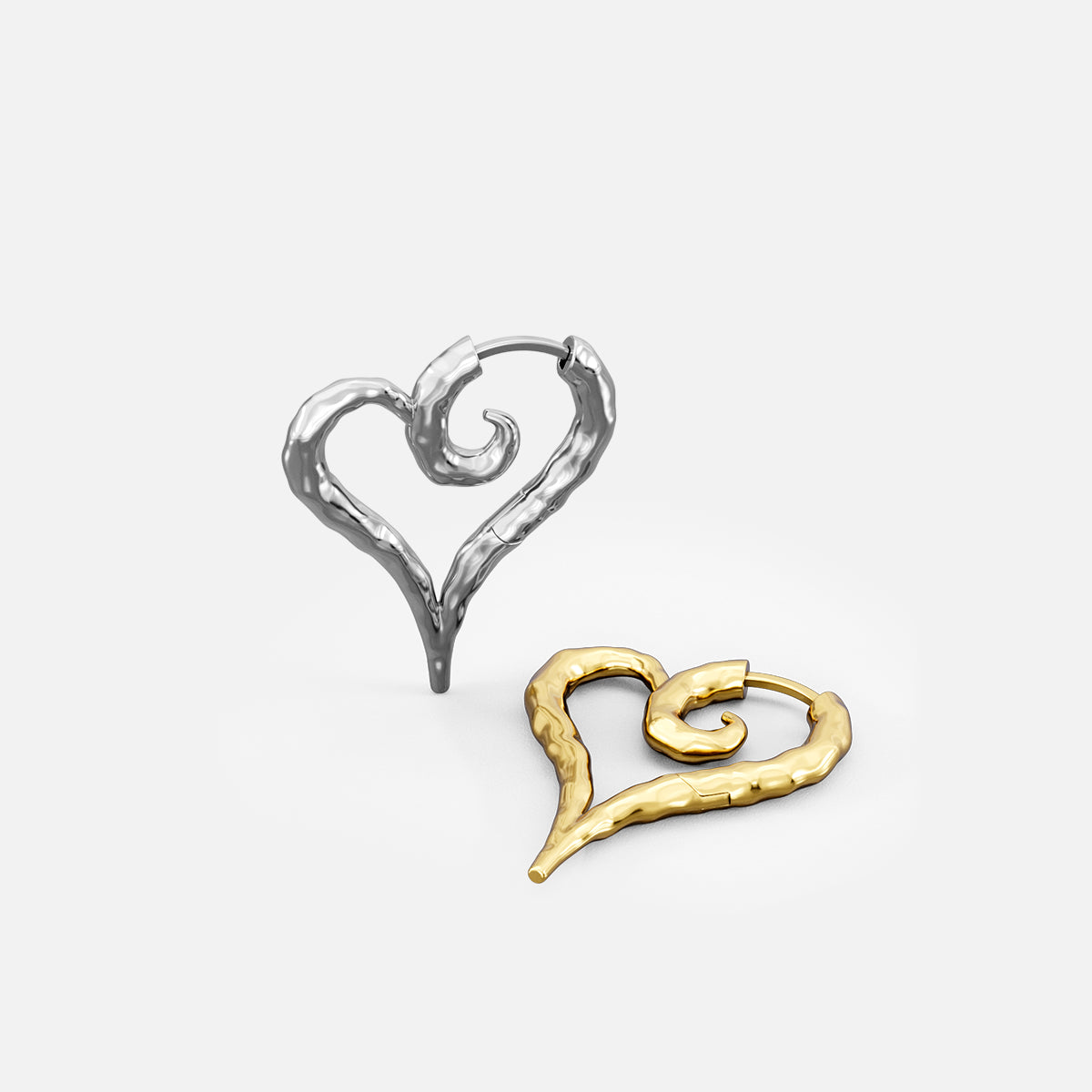 Silver and gold Ethereal Heartflow earrings shown upright and lying flat