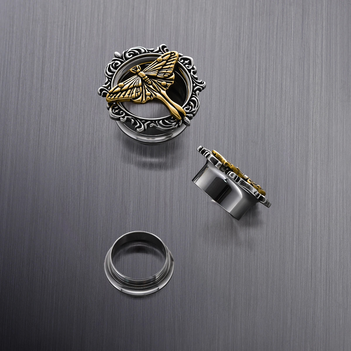Close-up of Ethereal Moth tunnel with gold moth and silver scrollwork frame