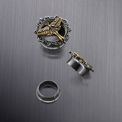 Close-up of Ethereal Moth tunnel with gold moth and silver scrollwork frame