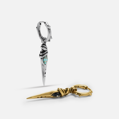 Eye Dagger Earrings shown in silver and gold tones with long dagger drop design