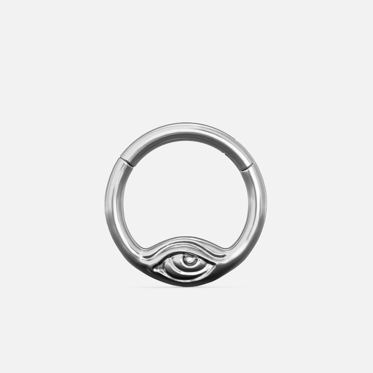 Silver-tone Eyelock Clicker with a sculpted eye detail along the lower edge, shown on a light gray background.