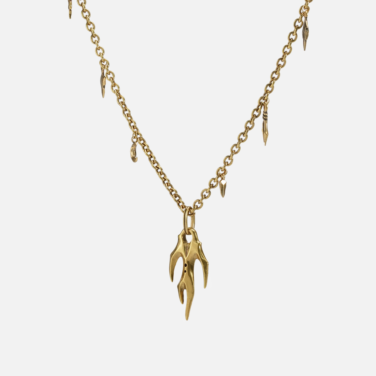 Feral Husk Necklace in 18K gold plating with antiqued claw pendant and charm chain