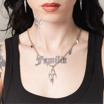 Silver Feral Husk Necklace styled on model with gothic woodland inspired pendant design