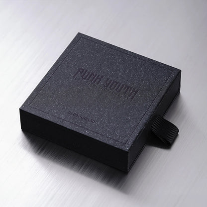 Black PUNKYOUTH jewelry presentation box shown closed on a reflective surface