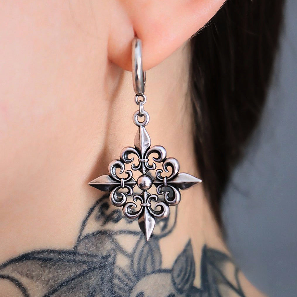 FLEUR-DE-LIS ELEGANCE EARRINGS worn