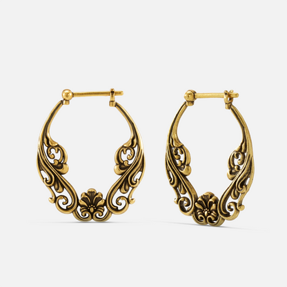Pair of antique gold-tone hoop earrings featuring an ornate floral scroll pattern, front view