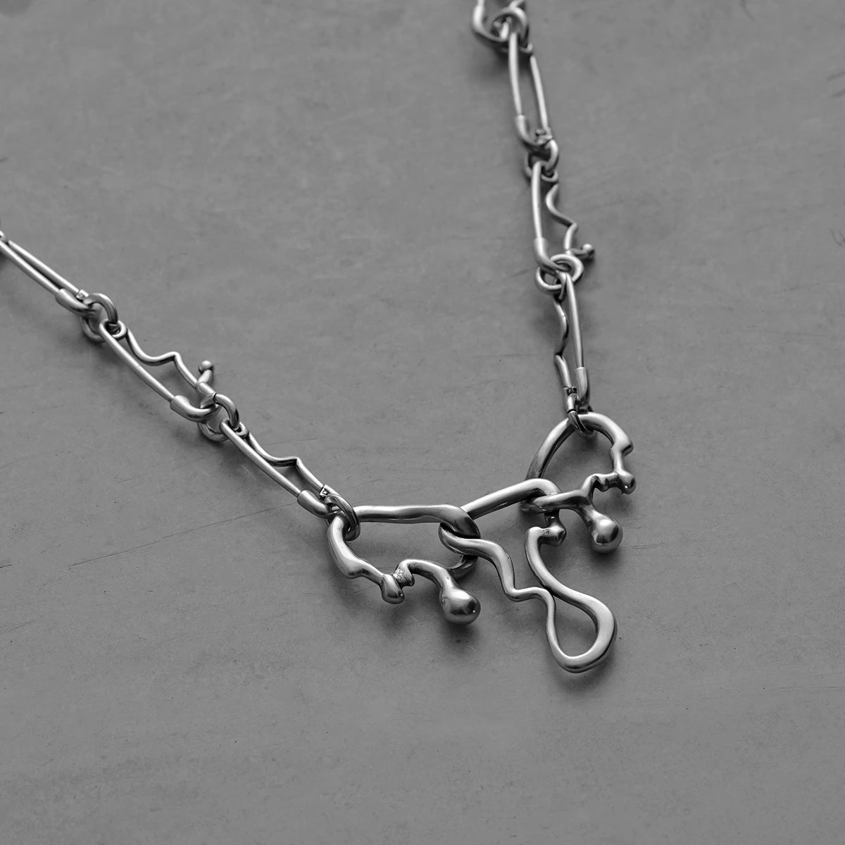 Silver Fluid Pin necklace with irregular liquid-shaped links