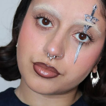 Silver Focused Fang Clicker styled on model with central fang point and minimalist gothic septum jewelry look