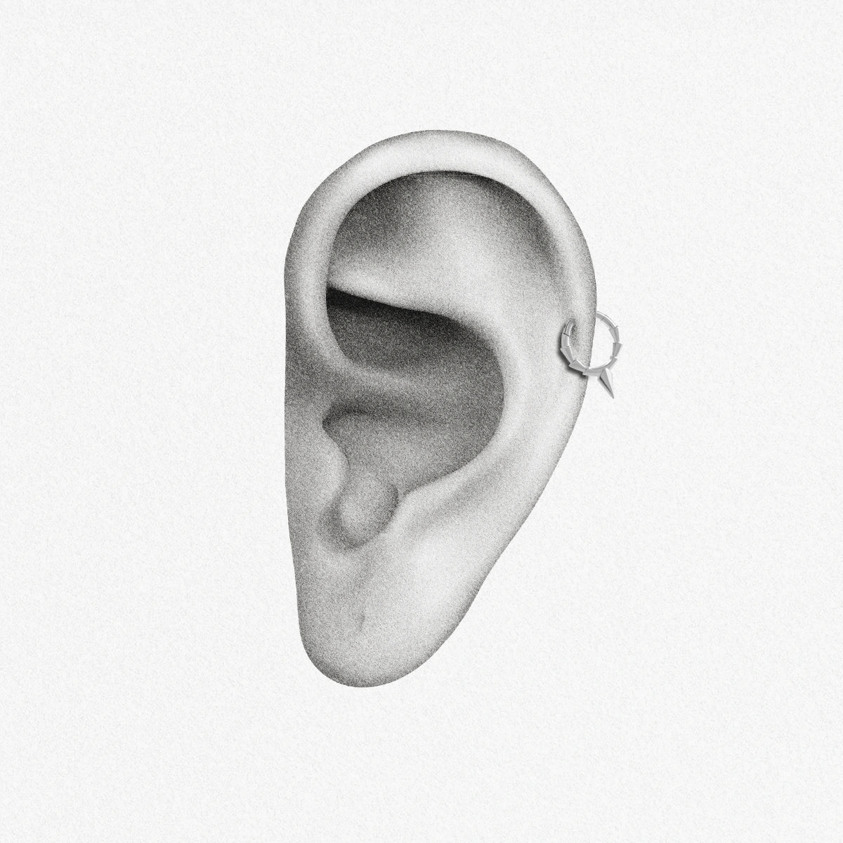 Silver Focused Spike Clicker shown on ear placement with segmented hoop and pointed spike detail
