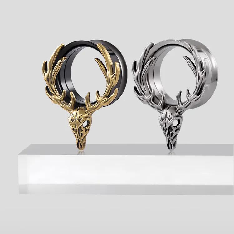 Gold and silver Forest Guardian tunnels displayed on a white pedestal