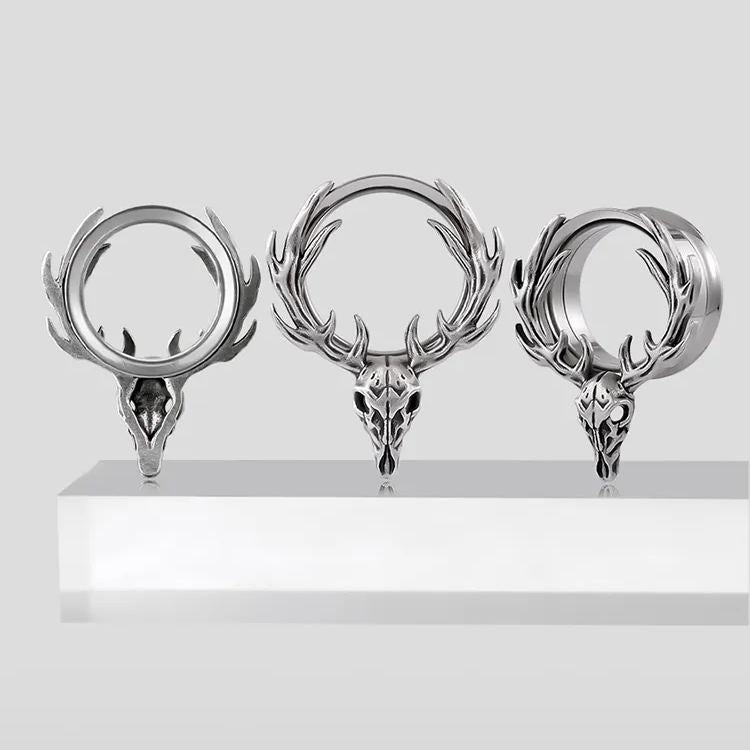 Three sizes of silver Forest Guardian tunnels displayed on a white pedestal