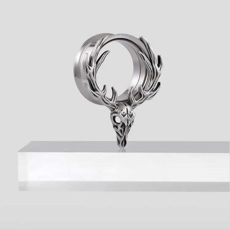 Single silver Forest Guardian tunnel displayed upright on a white pedestal