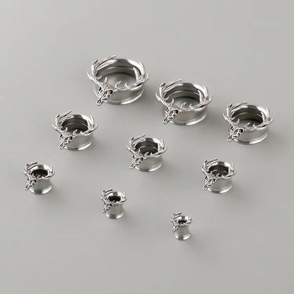 Silver Forest Guardian tunnels in graduated sizes arranged on a light surface
