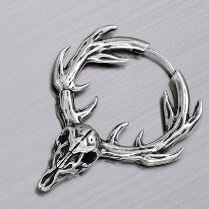 Close-up of silver Forest Stag hoop earring with antlered skull detail