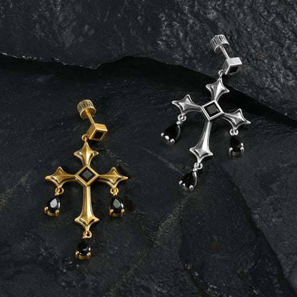 Silver and gold Forsaken Vow Earrings arranged together on black textured fabric.