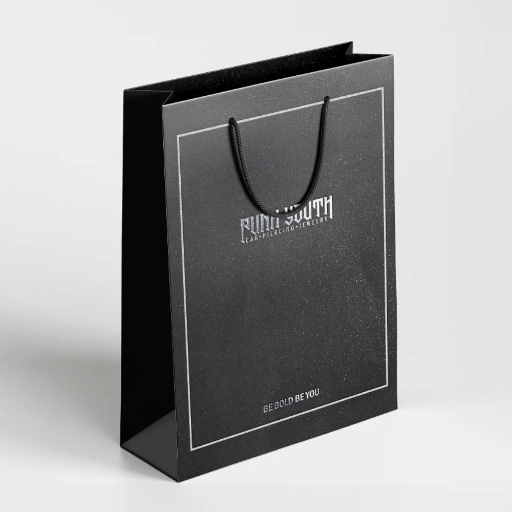 Black PUNKYOUTH gift bag with rope handles and a silver border