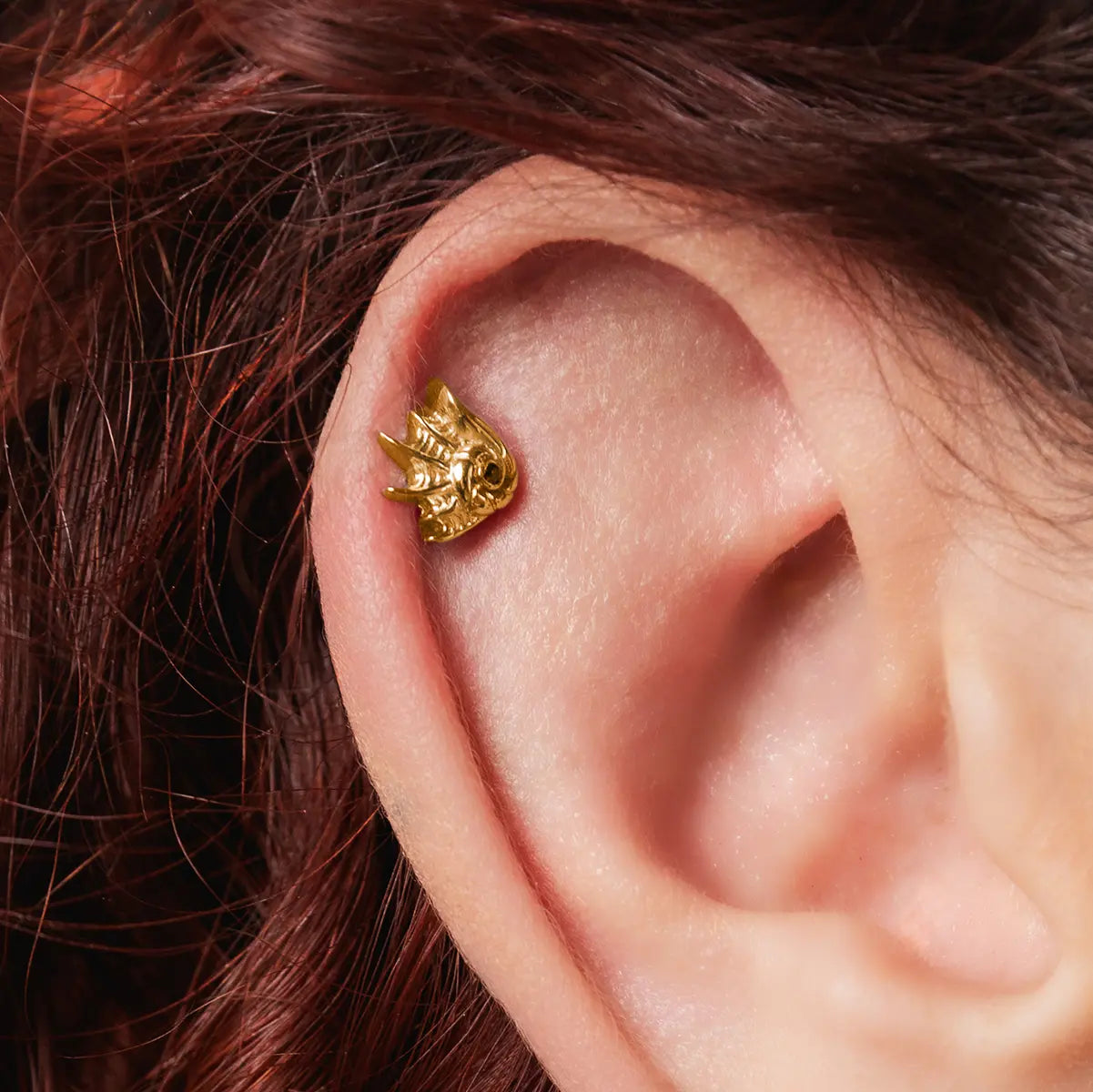 Gold siren jewelry conch flat back stud piercing styled on model ear